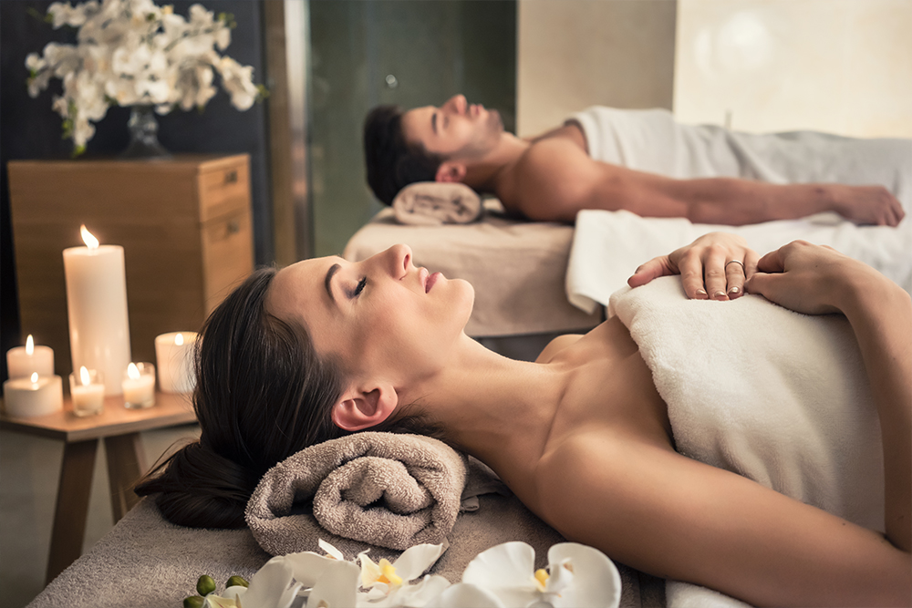 Couple relaxes during a wellness treatment in the spa area of a hotel