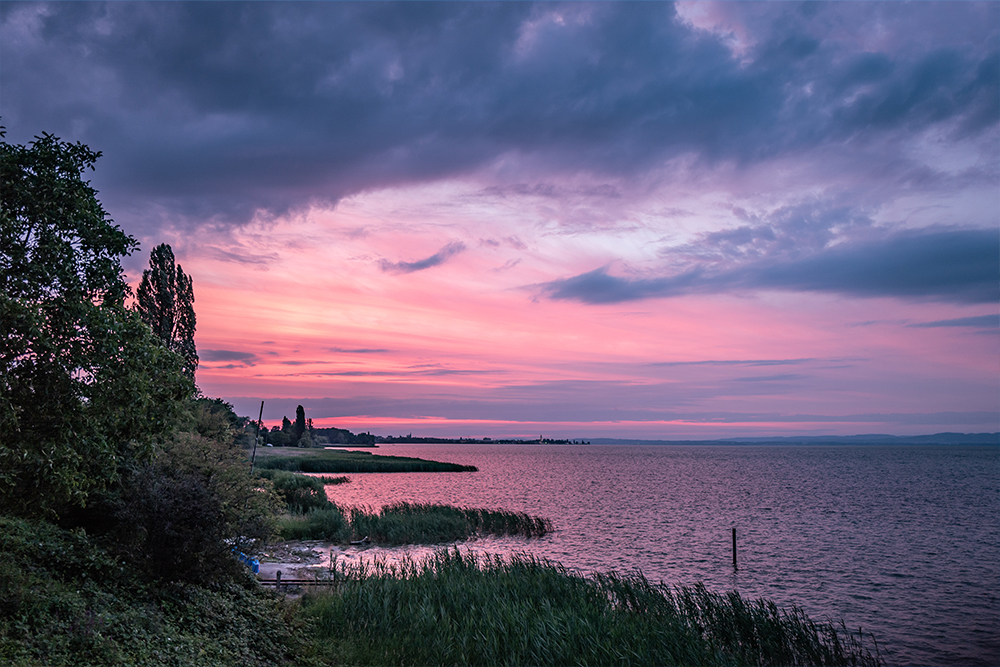 Romantic sunset on the shores of Lake Constance with a view of nature