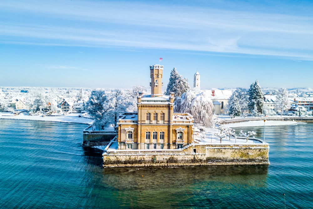 Landmark of Lindau on Lake Constance with a snowy winter backdrop